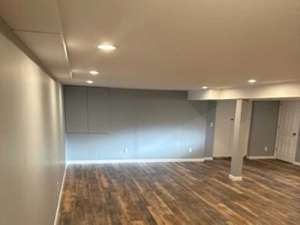 The Basic Basement Co. - Finished Basement with a Half Bathroom and Coretec ProPlus Flooring - Lake Hiawatha, New Jersey - December 2022