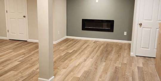 The Basic Basement Co. - Finished Basement with Coretec ProPlus Wheldon Oak flooring and electric fireplace installations - Bridgewater, New Jersey - May 2023